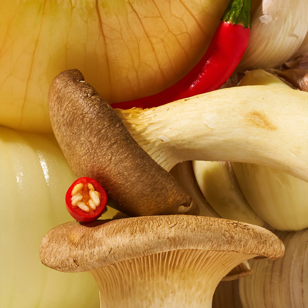 Zoomed in look of Mama Teav'es Hot Garlic Chili Crisp Ingredients: mushrooms, chilis, onions, and garlic